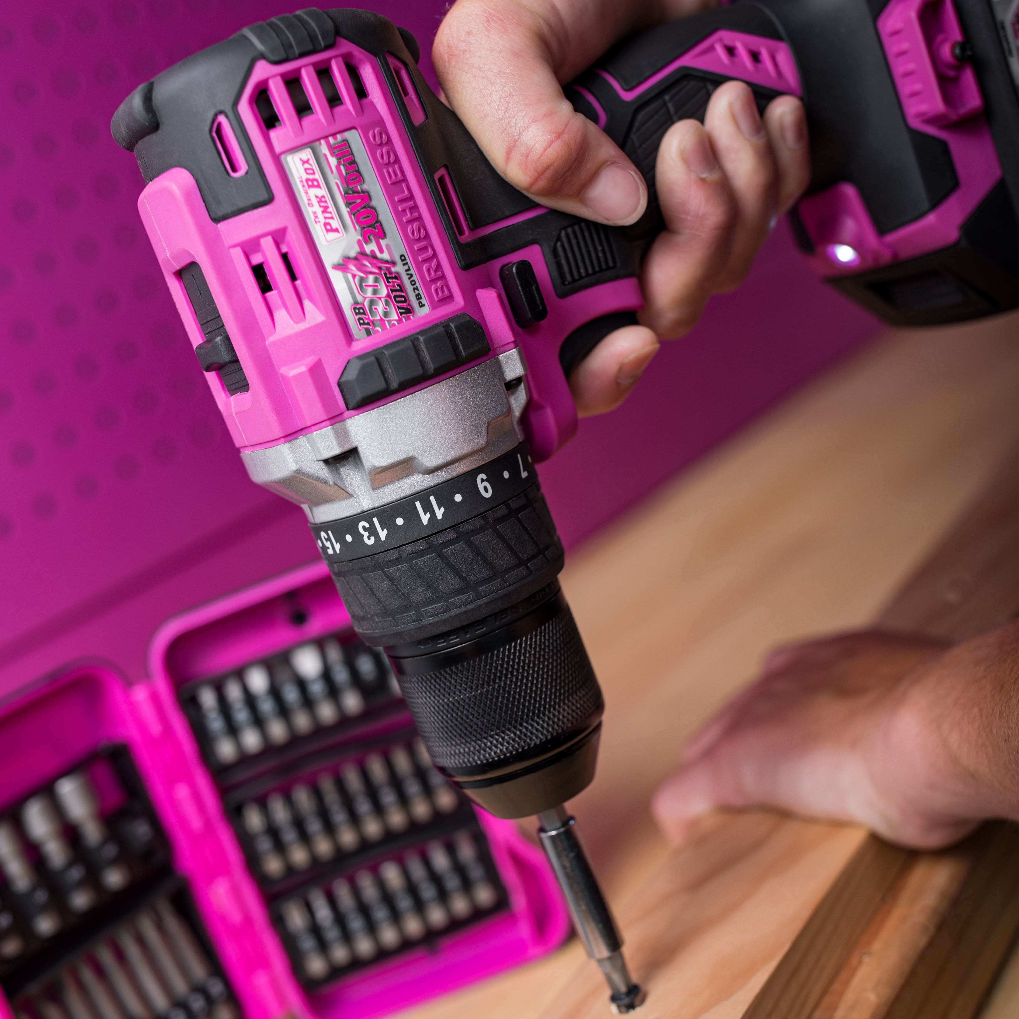 pink drill being used on piece of wood